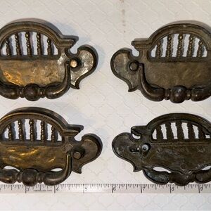 Set of 4 antique/vintage furniture drawer pulls. Model #’s on backs.